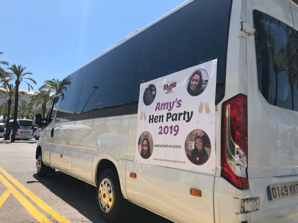 palma airport transfer bus with hen party banner